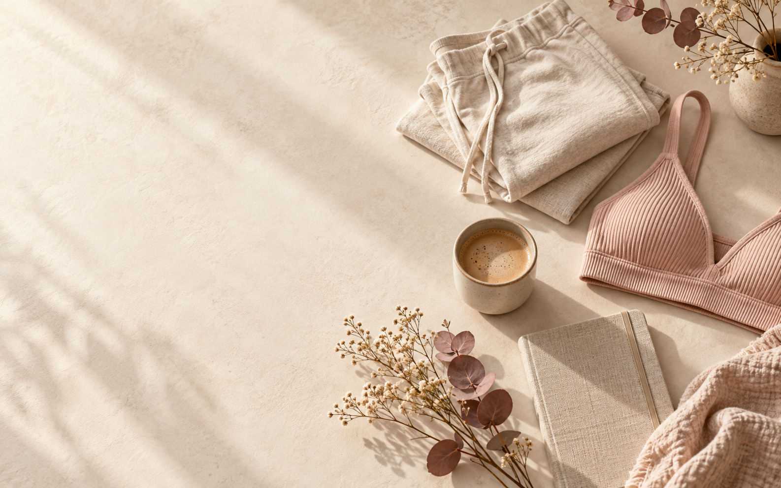 Calm flat-lay of everyday essentials designed around real life